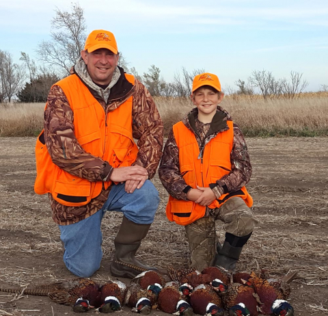 Owner of Mill Pond Retrievers, David Eaton, with his son Will