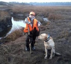 Young hunter and his dog