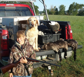 Young hunter with his yellow lab